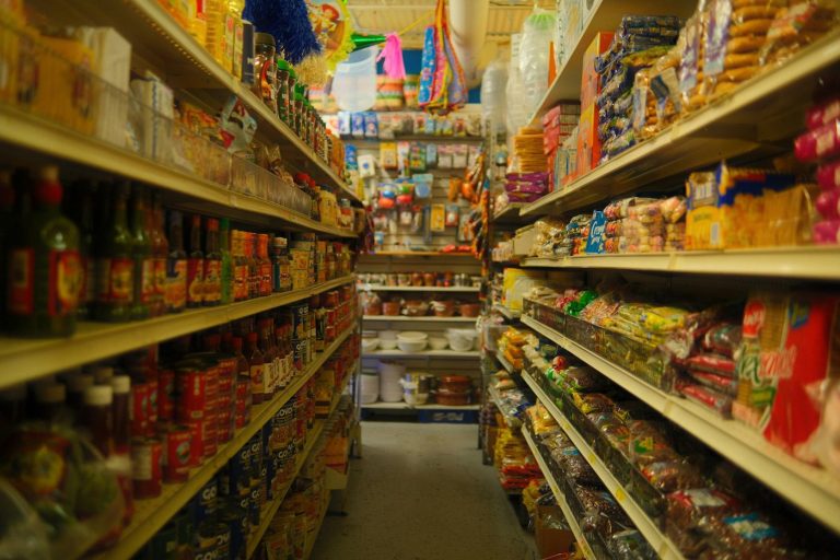 Store aisle full of canned goods and packaged products